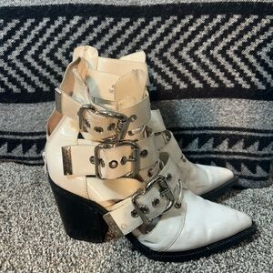 white patent leather boots with buckles